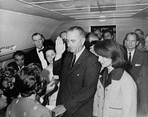 Lyndon B. Johnson taking the oath of office on...